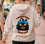 Person wearing a hoodie with a Halloween-themed design and text.