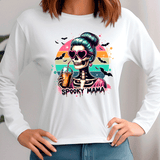 White sweatshirt with a colorful skeleton design and 'Spooky Mama' text on a plain background