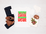 Holiday-themed shirt with text and festive design, paired with jeans and boots on a white background.