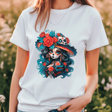 Person wearing a white t-shirt with a colorful skull and floral design.