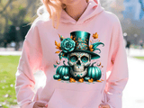 Person wearing a pink hoodie with a colorful skull design in an outdoor setting