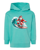 Turquoise hoodie with a graphic of Santa Claus surfing on a wave.