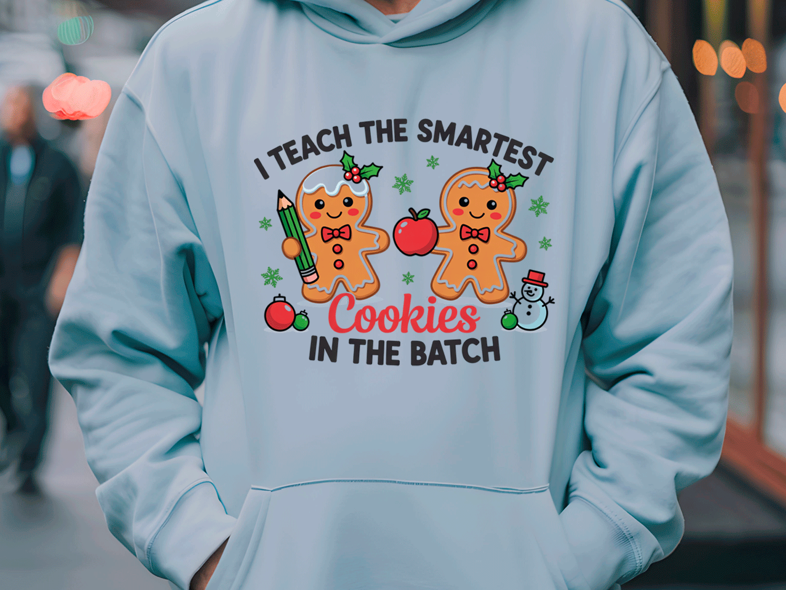 Light blue hoodie with gingerbread-themed design and text