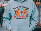Light blue hoodie with gingerbread-themed design and text