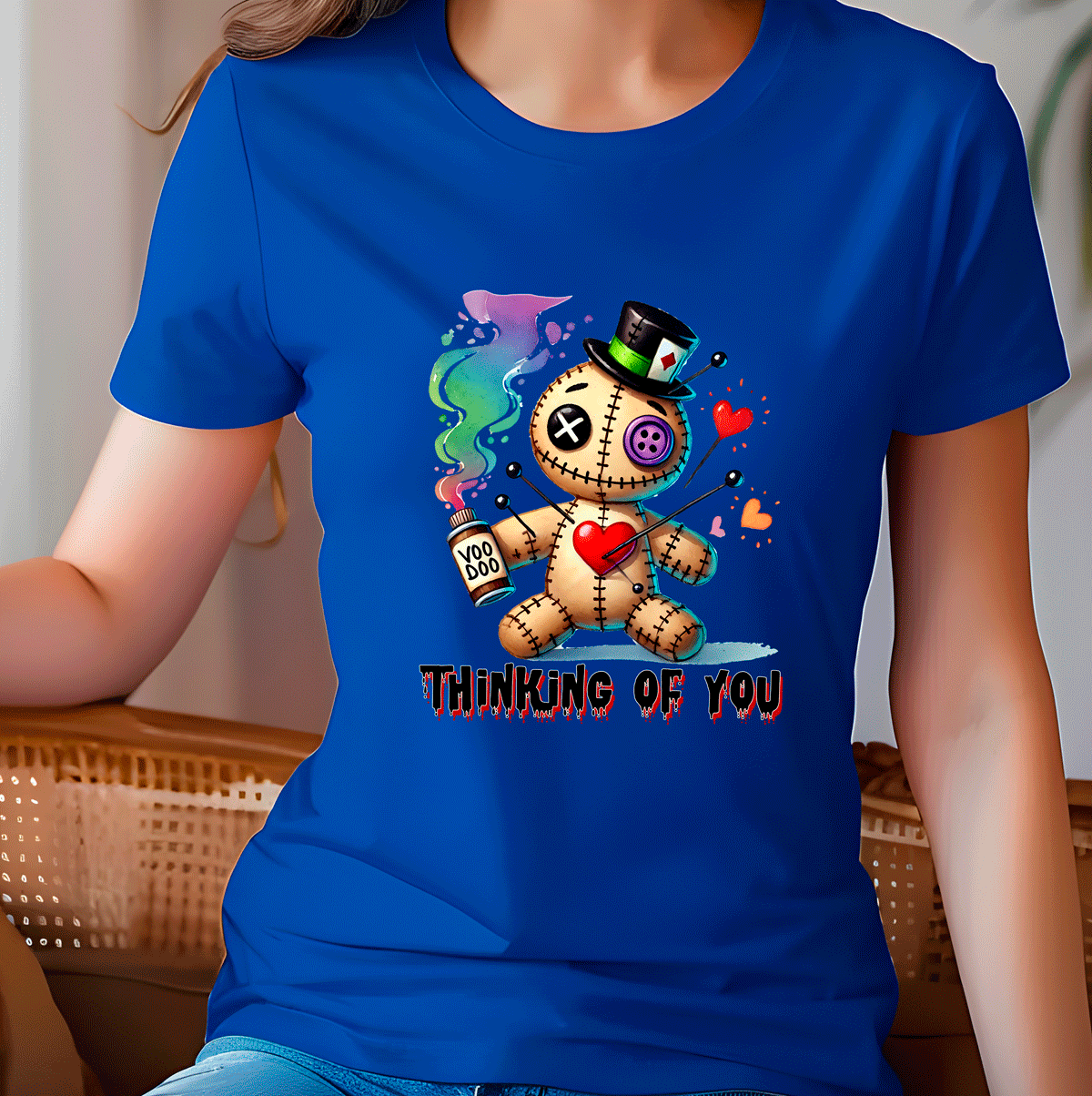 Person wearing a blue t-shirt with a cartoon character and text 'Thinking of You'.