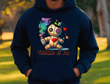 Person wearing a navy blue hoodie with a voodoo doll graphic and 'Thinking of You' text.