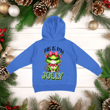 Blue hoodie with a Christmas-themed design on a wooden background with festive decorations.