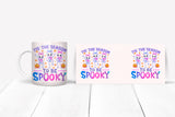 Two Halloween-themed mugs with cartoon ghosts and pumpkins on a white surface.