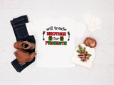 T-shirt with Christmas design, jeans, boots, and baby outfit on a white background