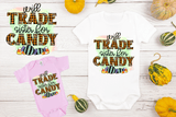 Two baby onesies with Halloween-themed text on a wooden surface with pumpkins.