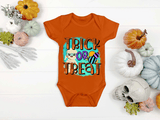 Orange onsie with halloween graphic with a halloween theme background