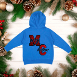 Blue hoodie with 'Merry Christmas' design on a wooden surface with holiday decorations.
