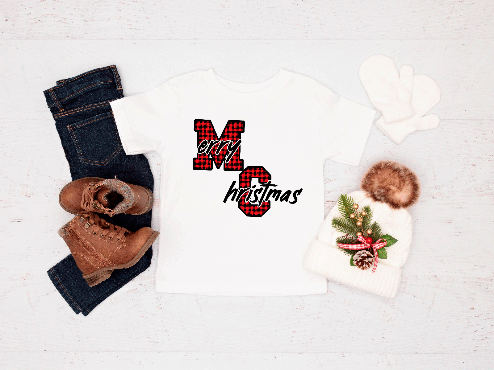 Holiday-themed items including a tee, jeans, boots, and a hat with a Christmas design on a white background.