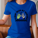 Person wearing a blue t-shirt with a graphic design and text.