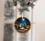 Decorative Christmas ornament with nativity scene hanging on a tree branch.