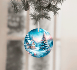 Christmas ornament with a snowy village scene on a tree branch.