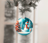 Christmas ornament with a snowman design hanging on a tree branch.