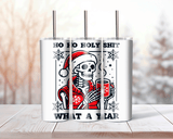 Tumbler with skeleton wearing a Santa hat and text 'Ho Ho Holy Shit, What a Year' on a wooden surface.