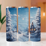 Three tumblers with a winter scene design featuring snow-covered trees and houses.