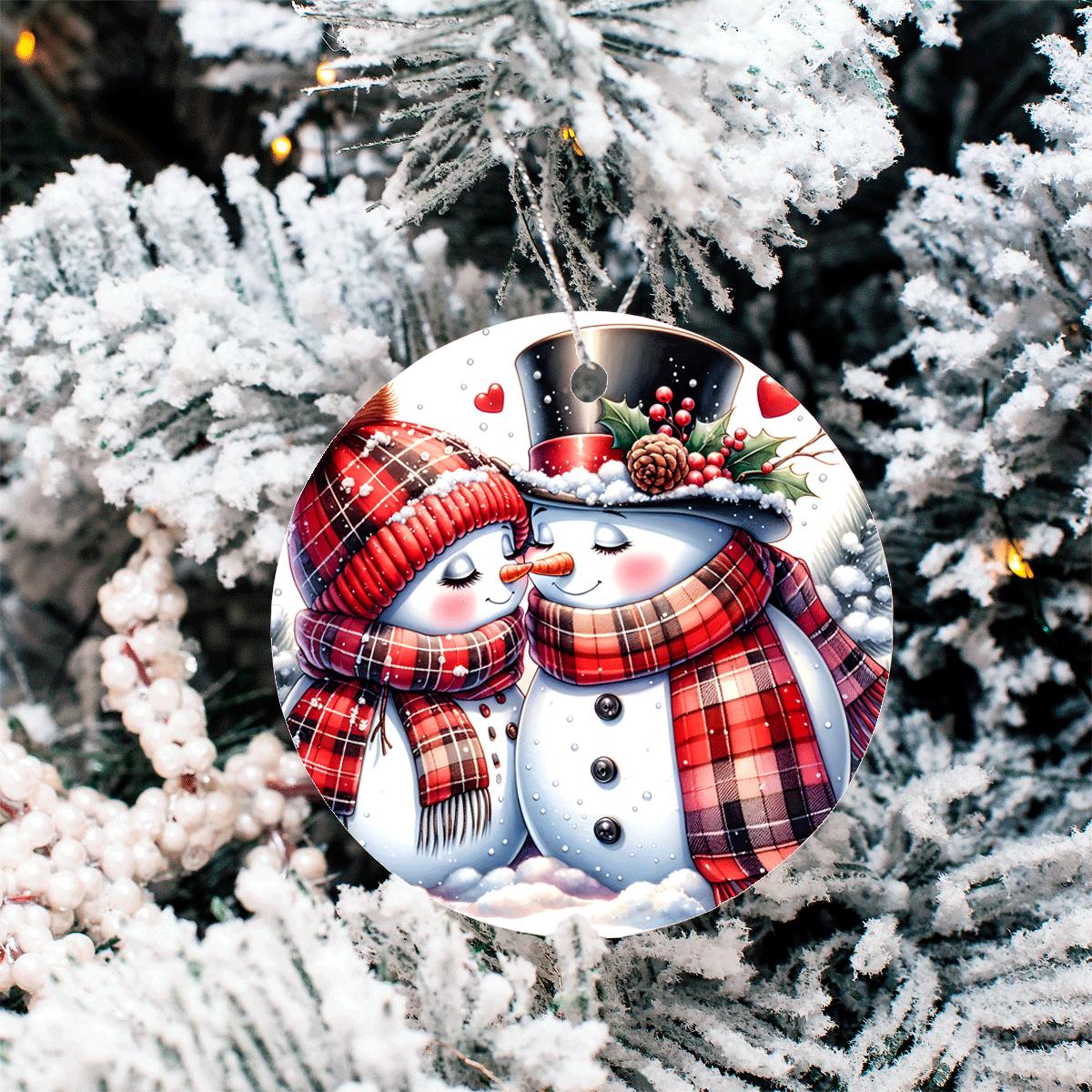 Decorative Christmas ornament with snowmen on a tree