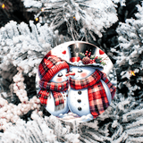 Decorative Christmas ornament with snowmen on a tree