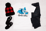 Winter-themed clothing and accessories on a white background with 'Winter Vibes' text.