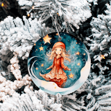 Decorative Christmas ornament with a girl in a red coat and stars on a snowy tree background