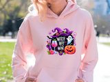 Person wearing a pink hoodie with Halloween-themed design outdoors