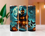 Three Halloween-themed tumblers with spooky designs on a marble surface.