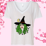 White V-neck t-shirt with a witch graphic on a pink floral background