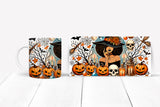 Halloween-themed mug with pumpkins, candles, and a witch design on a white background.
