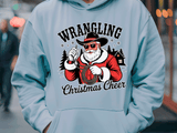 Light blue hoodie with a graphic of a cowboy Santa Claus and 'Wrangling Christmas Cheer' text.