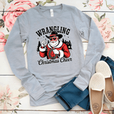 Gray long-sleeve shirt with Santa Claus graphic and 'Wrangling Christmas Cheer' text on a floral background.