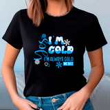 Person wearing a black t-shirt with blue text and snowflake graphics.