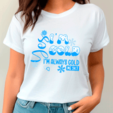 White t-shirt with blue text and graphics worn by a person against a neutral background